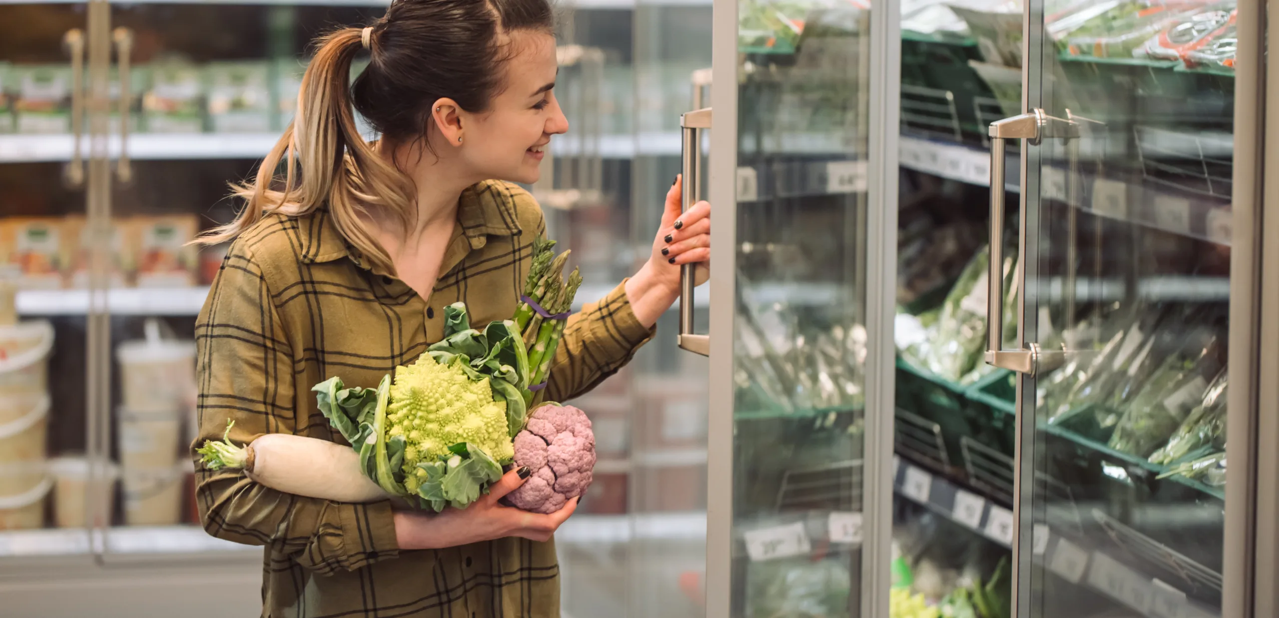 Woman holding fresh vegetables
