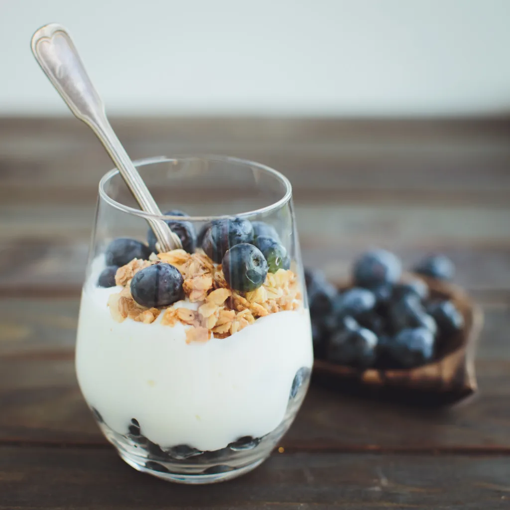 Yogurt with granola and fresh blueberries